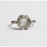 An 18ct white gold rock crystal set ring, the central untested round mixed cut colourless rock