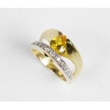 A 14ct gold stone set dress ring, comprising an untested pear cut yellow gemstone (measuring 8mm x