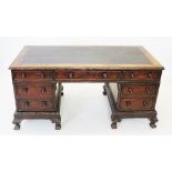 A Victorian mahogany twin pedestal desk, the rectangular top with inset writing surface, enclosed by