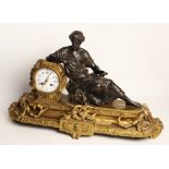 A late 19th century French gilt metal and spelter mantel clock, surmounted with a spelter