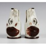 Two Staffordshire hound mask stirrup cups, each naturalistically modelled and