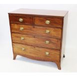 A Regency mahogany chest of drawers, the rectangular top with a reeded edge, over two short and