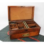 A 19th century mahogany games compendium, the hinged cover centred with an inlaid brass cartouche,