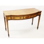 A George III mahogany and satinwood cross banded side table, the bow front top above two satinwood