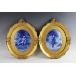 Two Doulton Burslem pottery flow blue oval plaques, painted by Kelsall, each in gilt gesso frame,