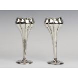 A pair of Edwardian silver tulip form posy vases by Synyer & Beddoes, Birmingham 1901, each on