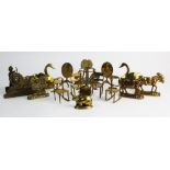 A collection of decorative brass pieces, to include miniature furniture models of chairs, rocking