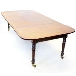 A 19th century mahogany extending dining table, the pair of 'D' end leaves enclosing up to four