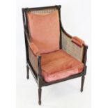 A 19th century mahogany bergere library tub chair, the rectangular rattan back rest flanked by