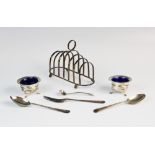 A silver six-division toast rack by E J Houlston, Birmingham 1946, of oval form with seven graduated