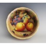 A Royal Worcester footed bowl, mid 20th century, hand decorated by Harry Ayrton with autumn fruits