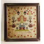 A Victorian pictorial sampler, depicting stylised fruit and foliage within a border of trailing