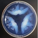 A Rene Lalique Nonnettes pattern bowl, the opalescent glass shallow bowl, moulded with three pairs