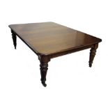 A Victorian oak extending dining table, the rectangular moulded top with rounded corners above a