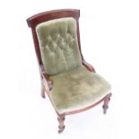A late Victorian walnut and upholstered drawing room chair, raised upon fluted and tapering front