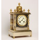 A late 19th century French mantel clock by Marti 'Medialle de Bronze', the two tone polished gilt
