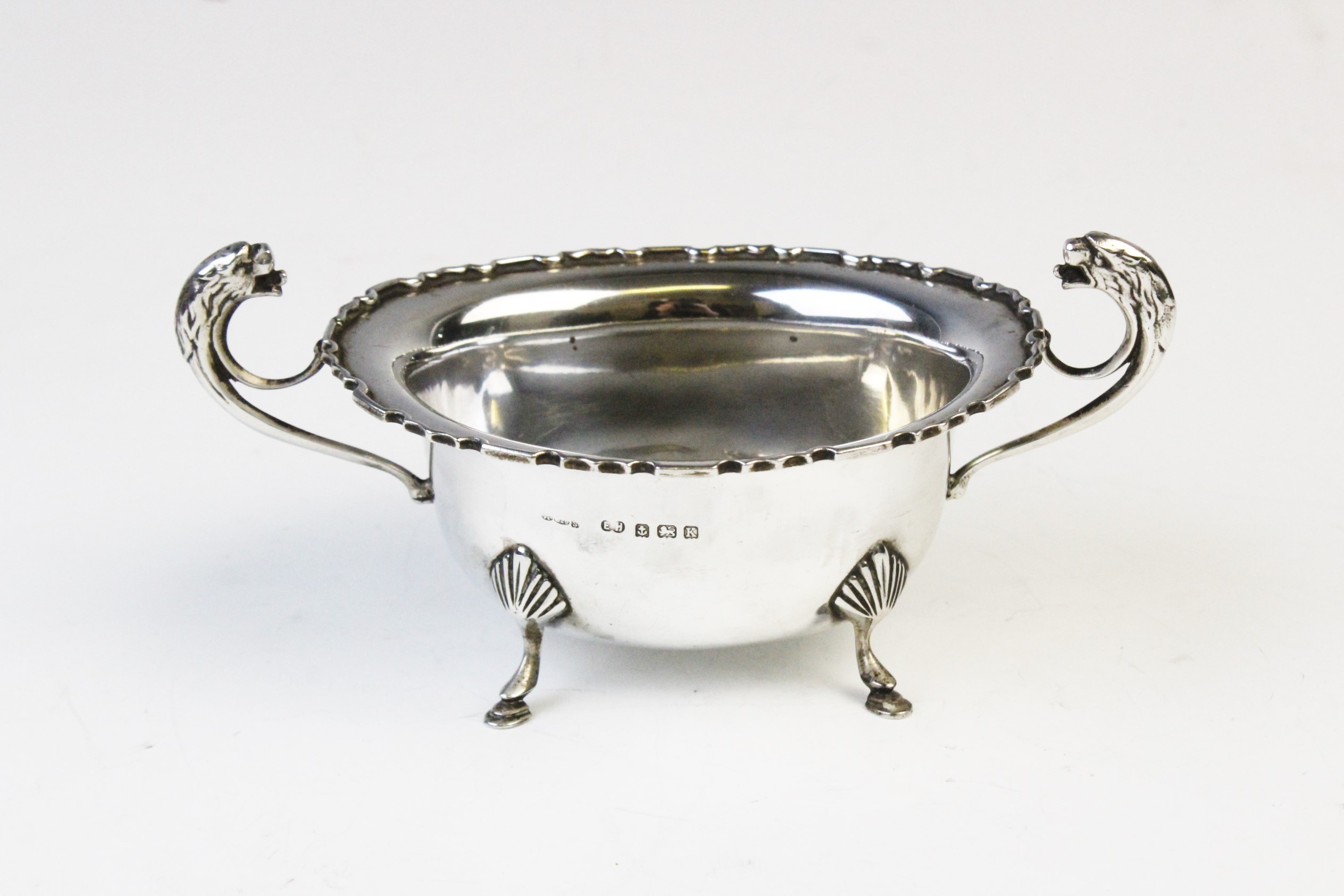 A George V twin-handled silver sugar bowl by E Hill, Birmingham 1934, of oval form with shaped - Image 4 of 4