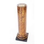 A late 19th century simulated marble pedestal, the column of fluted form, raised upon an
