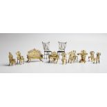 A mid 20th century boxed gilt metal filigree suite of French style miniature furniture, comprising a