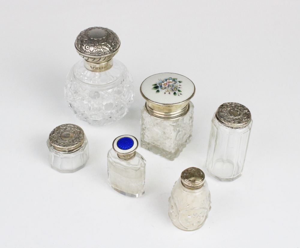 A selection of silver and white metal mounted dressing table jars, to include a cut glass, silver
