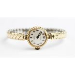A lady's vintage 9ct gold Everite 17 jewels incabloc wristwatch, the round pearlescent dial with