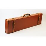 A leather bound 12 bore shotgun case and weather cover, the tan leather case with reinforced