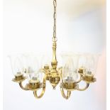 A gilt metal eight branch ceiling light fitting, mid 20th century, the baluster shaped stem