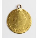 A George III guinea, date worn (17--), spade shield to reverse, with soldered pendant mount,
