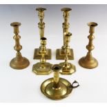 A pair of brass candlesticks, each with double knopped stems on spreading foot, 20.5cm high, with