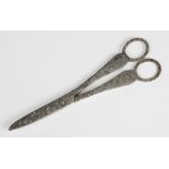 A pair of Victorian silver grape scissors, London 1896 (maker's marks worn), engraved with green man