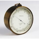 An early 20th century brass cased 'T Wheeler' compensated barometer, the drum shaped case