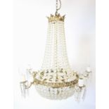 A gilt metal and glass droplet bell shaped pendant light fitting, mid 20th century, the lines of