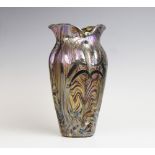 An Art Nouveau silver overlaid vase in the manner of Loetz, of shaped form with wrythen moulded