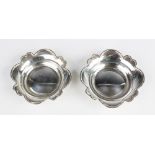 A pair of Edwardian silver bon-bon dishes by T H Hazlewood & Co, Birmingham 1909-10, each of round