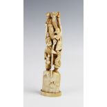 A Japanese signed ivory okimono, Meiji period (1868-1912), designed as a sage standing on a rocky