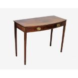 An early 19th century mahogany bow front side table, the cross banded top above a single frieze