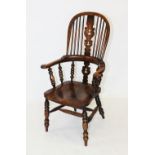 A 19th century ash and elm hoop back Windsor farmhouse elbow chair, the central pierced splat