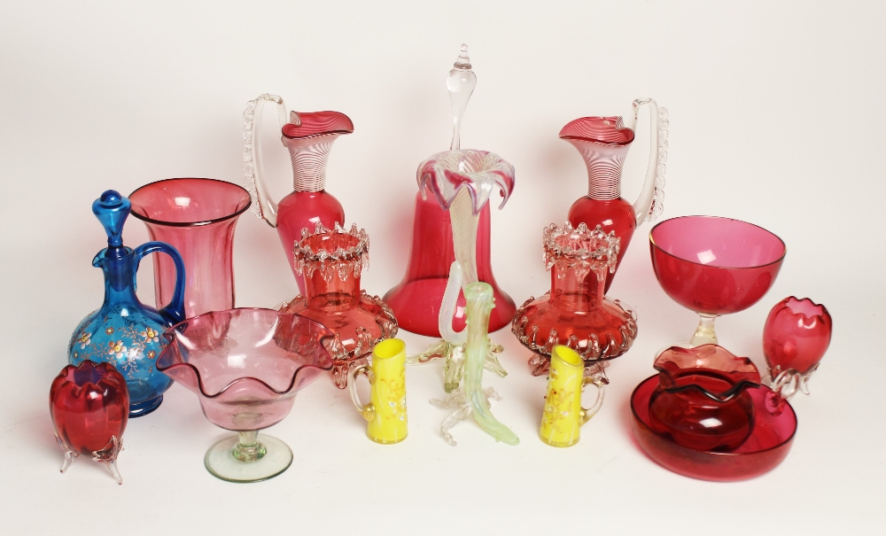 A collection of Victorian and later cranberry glass, to include a pair of ewers, 23cm high, a bell