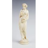 A late 19th century Dieppe carved ivory bacchanalian figure, possibly a Maenad, modelled as a