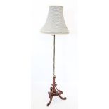 A 19th century walnut and brass standard lamp, the hexagonal brass pole cast with interlaced detail,