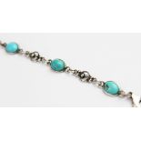 An Arts & Crafts style silver and turquoise bracelet, comprising six polished turquoise cabochons