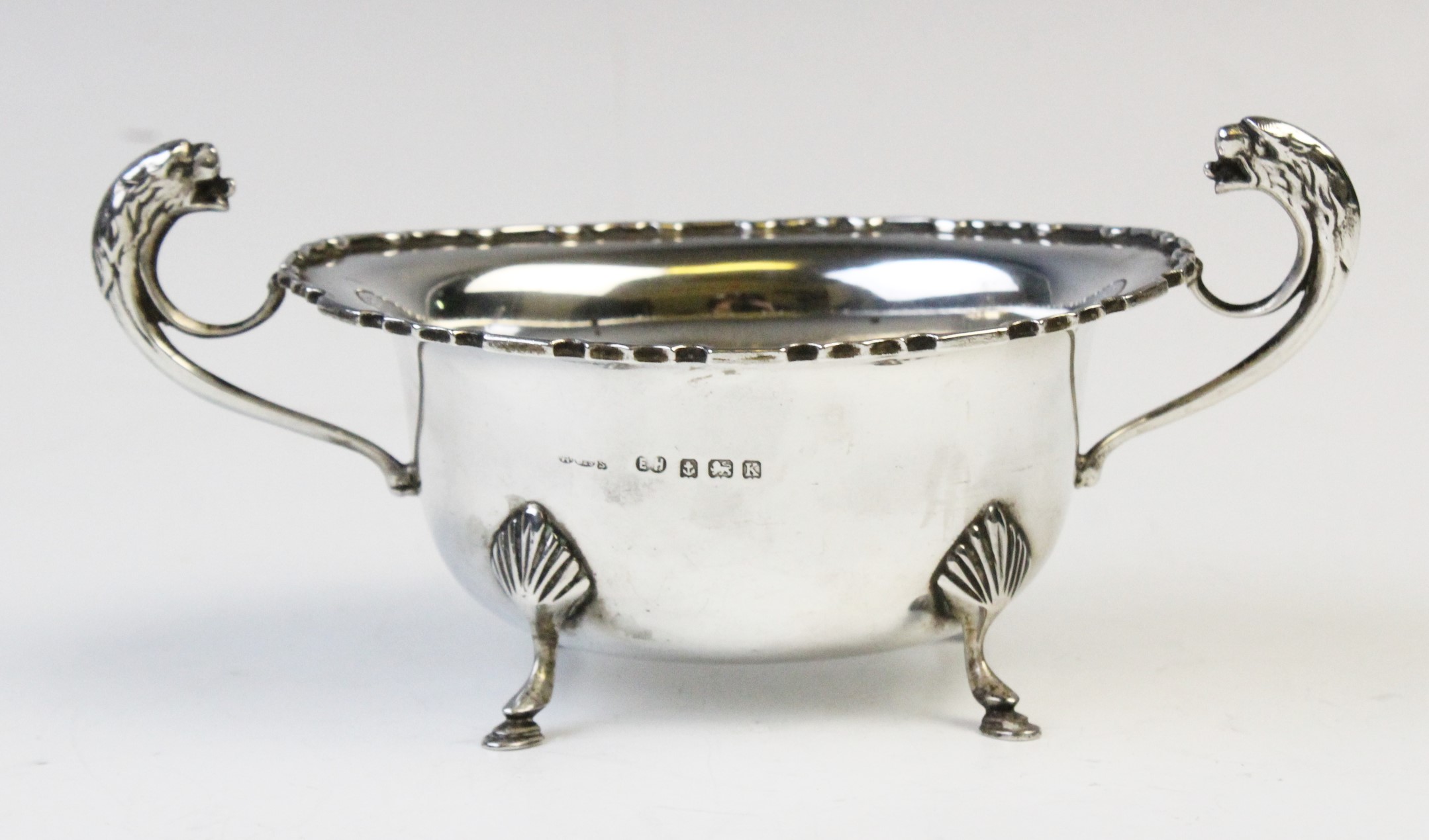 A George V twin-handled silver sugar bowl by E Hill, Birmingham 1934, of oval form with shaped - Image 3 of 4