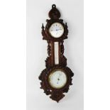 A Victorian carved oak nautical themed barometer and clock combined, the 9cm white enamel clock dial