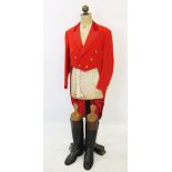 A scarlet evening hunt jacket with tails and gilt buttons, satin lined, 110cm long, along with a