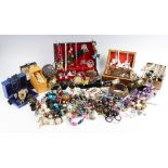 A large collection of vintage and modern costume jewellery, including beaded necklaces, chains,