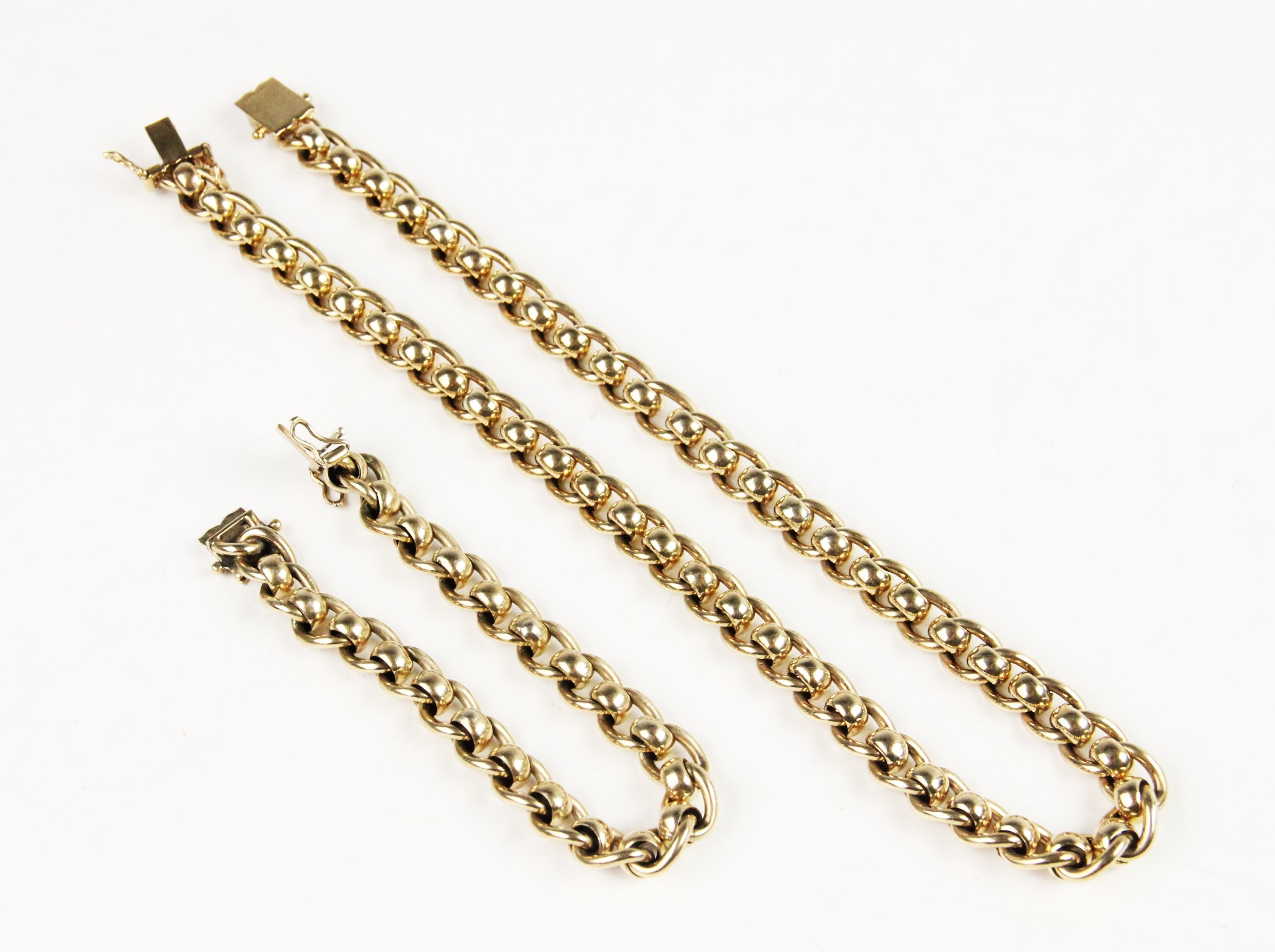 A 9ct gold curb link necklace and bracelet