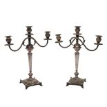 COPPIA CANDELABRI a tre fiamme in argento sbalzato (g. 1563). Italia XX secolo Misure: cm 34 x h