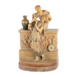 OROLOGIO in terracotta smaltata e lavorata raffigurante "Fanciulli" e "Gioco di putti" (rotture).