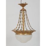 LAMPADARIO in bronzo con coppa in vetro. Italia primi '900 Alt. cm 60.