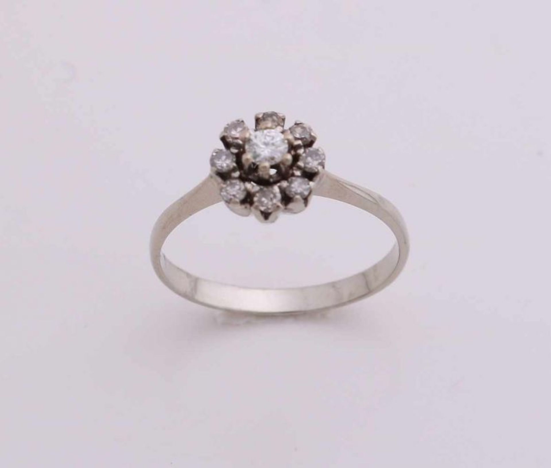 White gold ring rosette, 585/000, with diamond. Ring with a small rosette 9 brilliant-cut